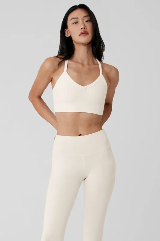 Seamless Ribbed Low Back Bra - Ivory sold by Alo Yoga