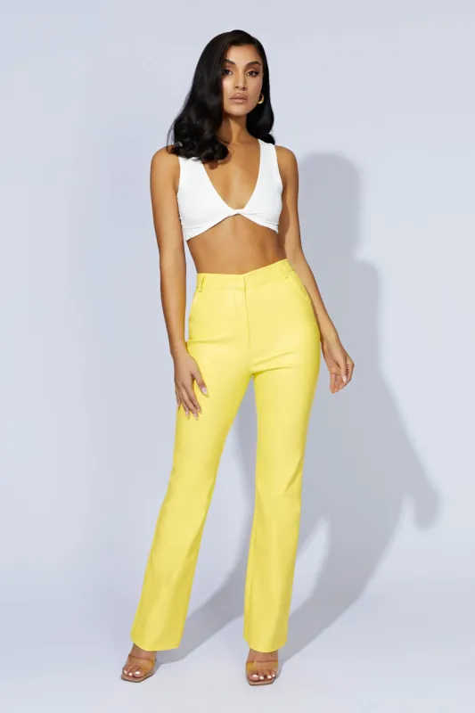 Tyra Straight Leg Faux Leather Pants - Lemon sold by Meshki