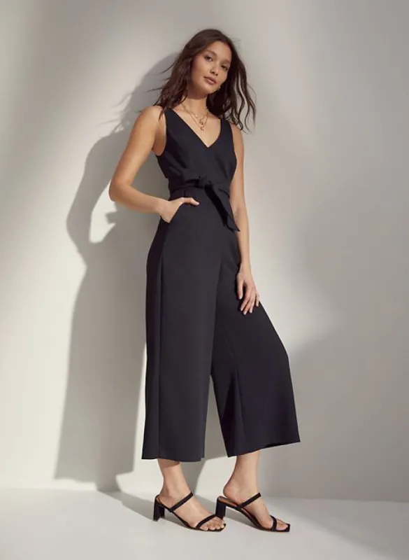 new écoulement v jumpsuit sold by Aritzia