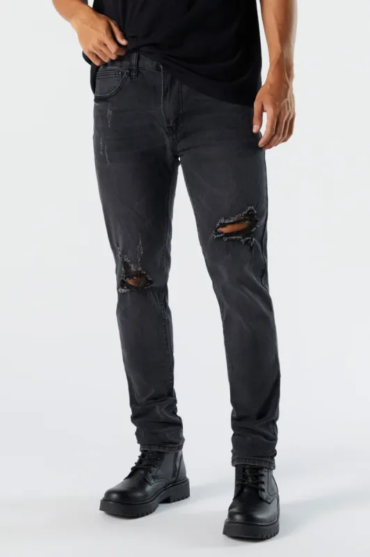 Jean en denim mince d'aspect usé délavé noir sold by Urban Planet