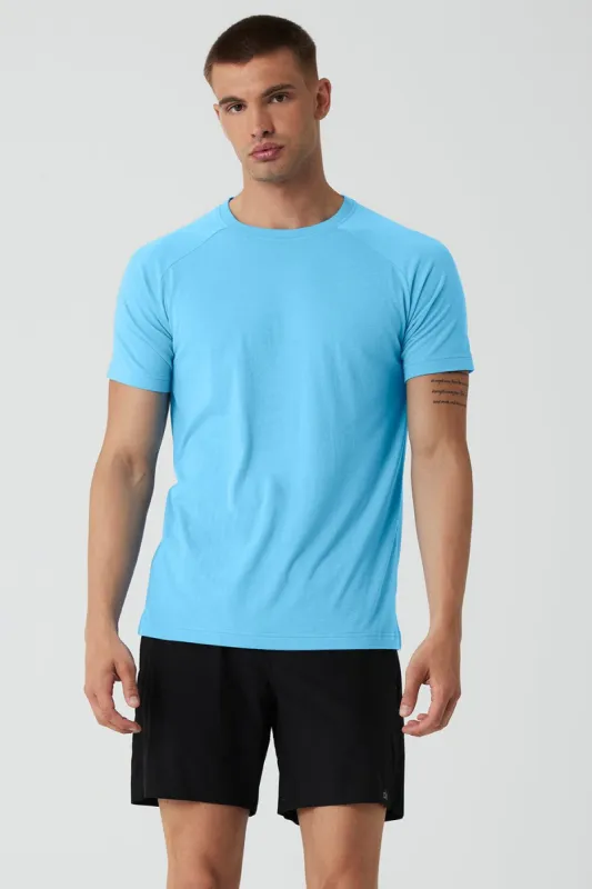 The Triumph Crew Neck Tee - Azure Blue sold by Alo Yoga