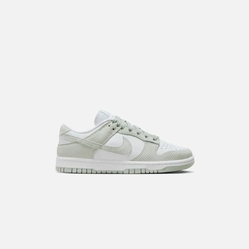 Nike WMNS Dunk Low - White / Light Silver sold by Kith