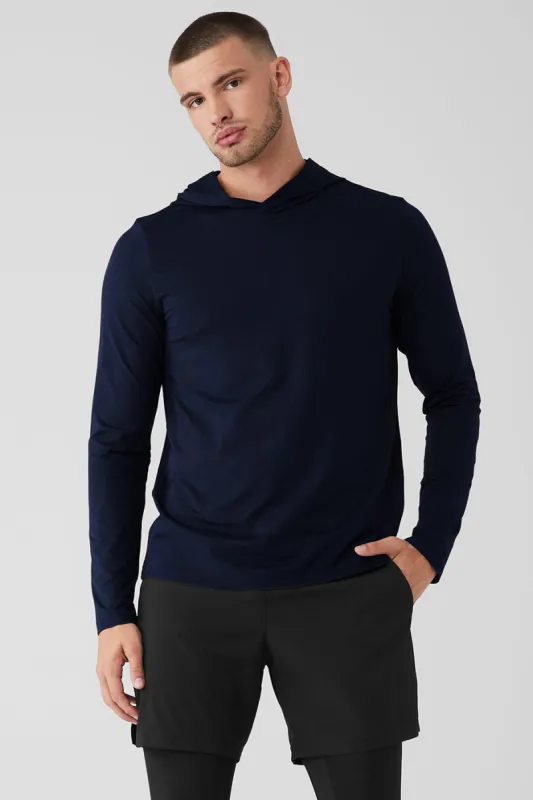 Conquer Reform Long Sleeve With Hood - Navy sold by Alo Yoga