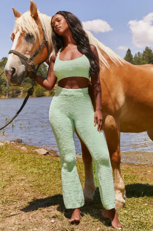 Petite Cosy Flared Leg Trousers in Green sold by Oh Polly