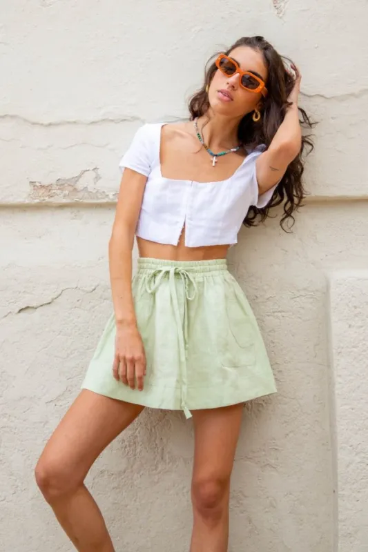 Cariño Linen Mini Skirt Sage sold by Verge Girl