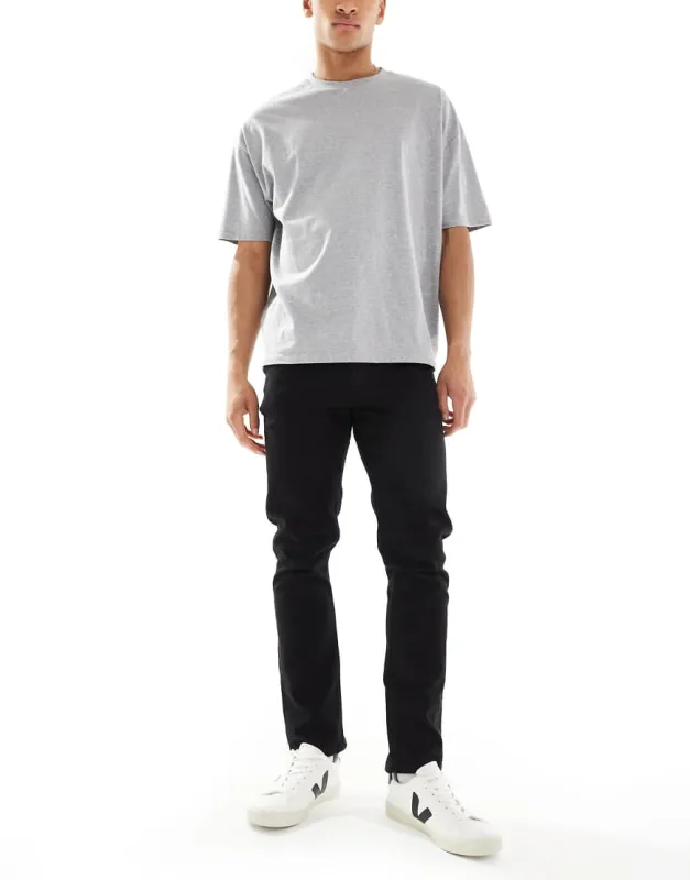 ASOS DESIGN stretch slim jeans in black sold by ASOS