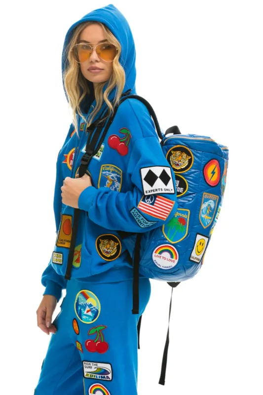 VINTAGE PATCH PUFFER BACKPACK - SNORKEL BLUE GLOSSY sold by Aviator Nation
