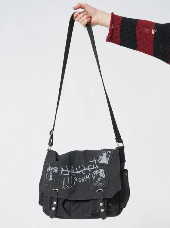 Troublemaker Black Canvas Messenger Bag sold by Minga London