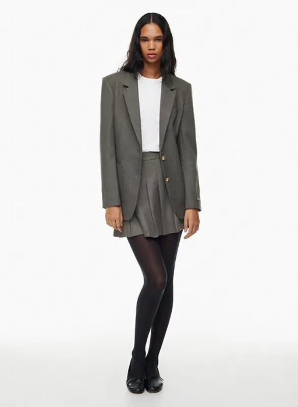 olive micro pleated skirt sold by Aritzia