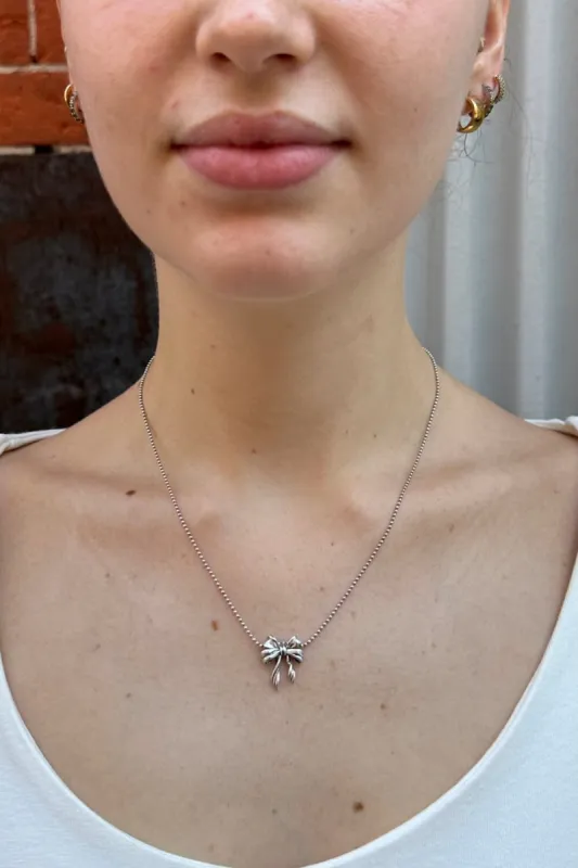 Bow Necklace sold by Brandy Melville
