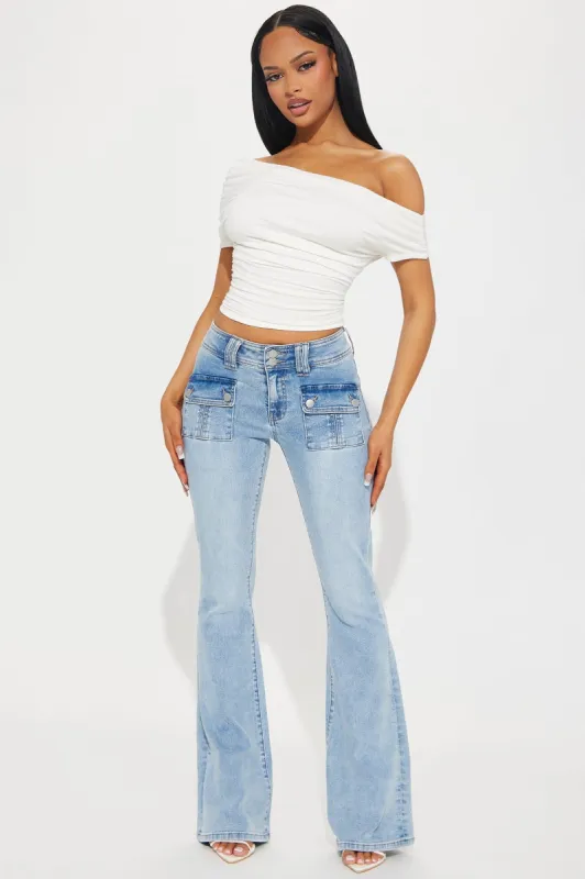 So Delusional Stretch Flare Jeans - Light Wash sold by Fashion Nova