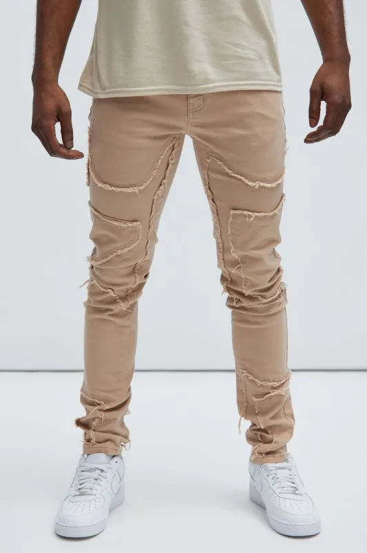 Got Your Back Patched Stacked Skinny Jeans - Taupe sold by Fashion Nova
