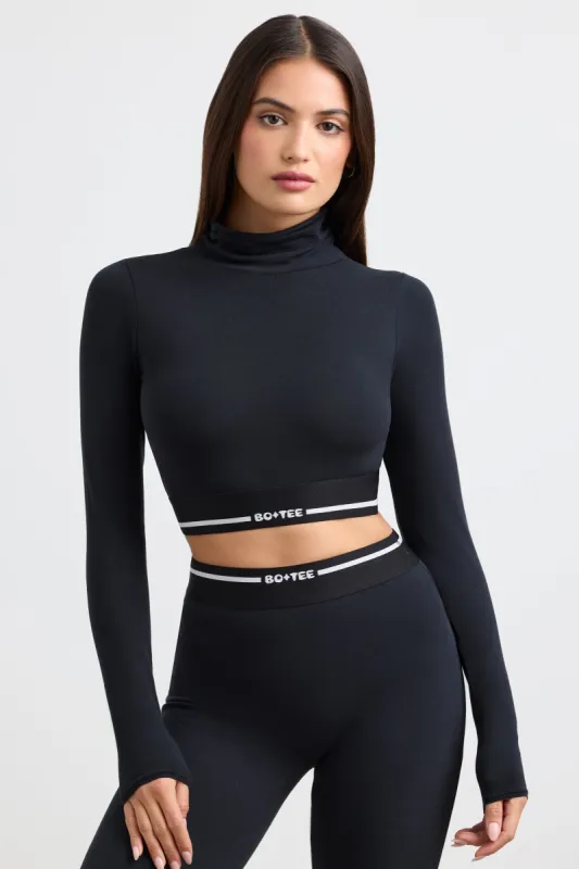 Grounded - Turtleneck Backless Long-Sleeve Crop Top in Black sold by Bo + Tee