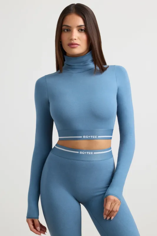 Turtleneck Backless Long-Sleeve Crop Top in Steel Blue sold by Oh Polly