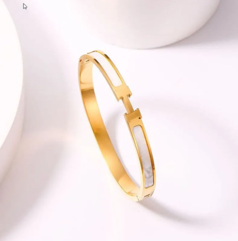 *Hanissa Golden H Bangle Bracelet sold by Chic Couture
