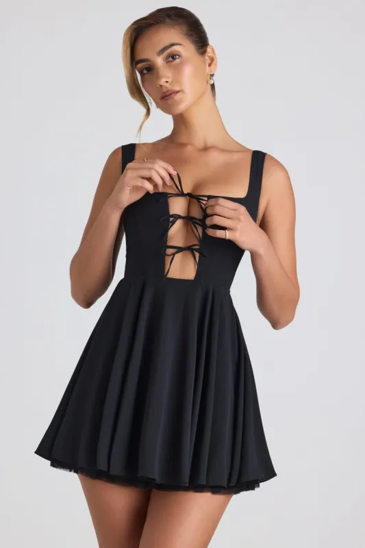 Tie-Detail A-Line Micro Mini Dress in Black sold by Oh Polly