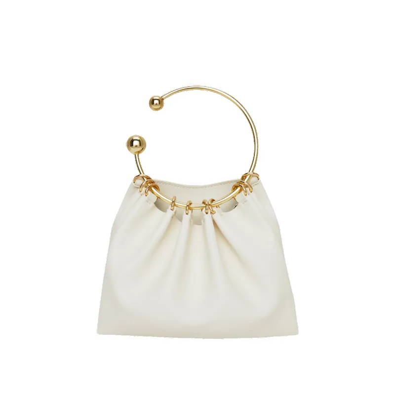 Cream Ring Handle Bag sold by VERAFIED