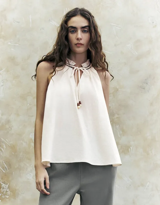 Sleeveless Tie Front Overhead Shirt sold by Urban Revivo