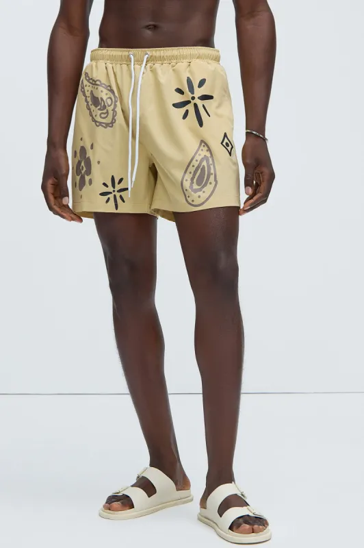 Moving Onward Swim Trunks - Tan sold by Fashion Nova