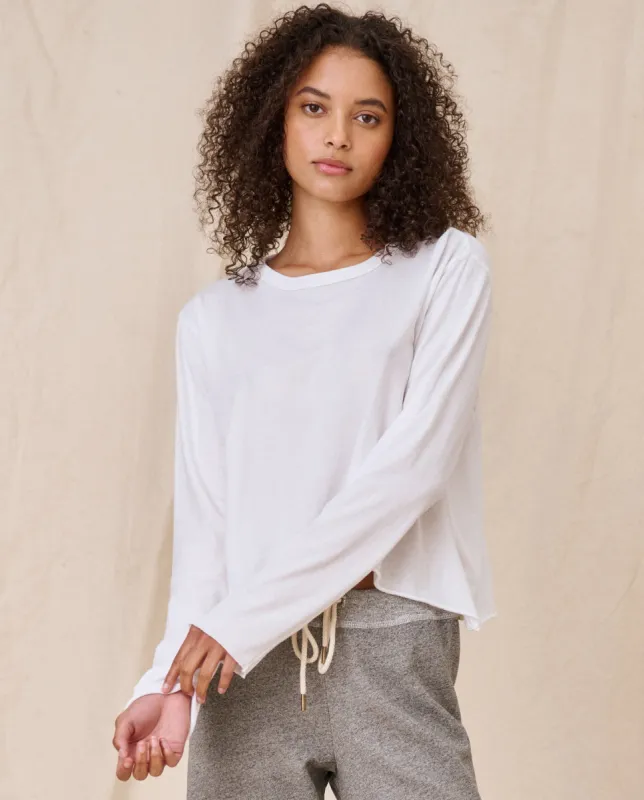 The Long Sleeve Crop Tee. -- True White sold by THE GREAT.