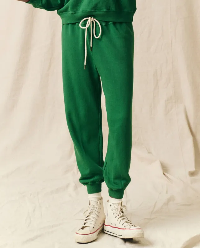 The Cropped Sweatpant. Solid -- Holly Leaf sold by THE GREAT.