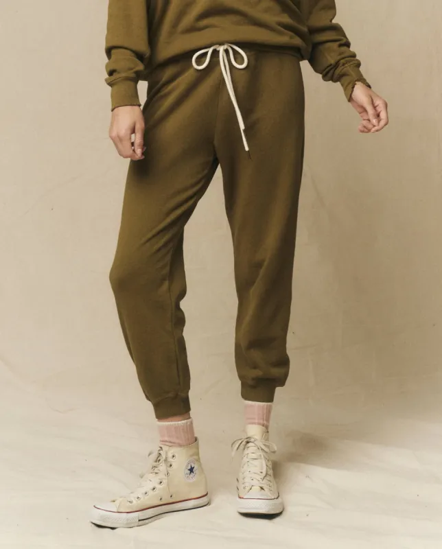 The Cropped Sweatpant. Solid -- Fir Green sold by THE GREAT.