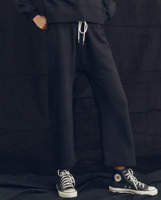 The Relay Sweatpant. Solid -- Almost Black sold by THE GREAT.