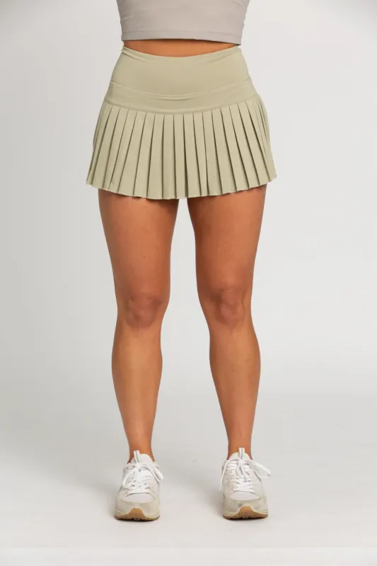 Pale Moss Pleated Tennis Skirt sold by Gold Hinge