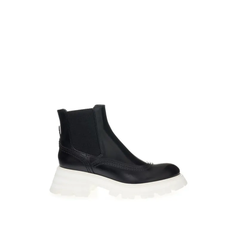 Elegant Leather Boots in Timeless Black sold by Louxly