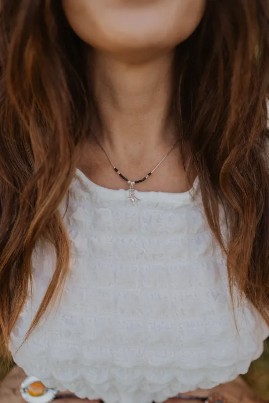 Black + Silver Cowboy Boot Necklace sold by Goldie Lew