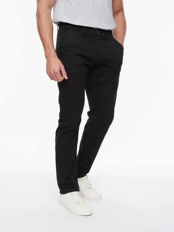Tasman Chinos Black sold by Brand Corner