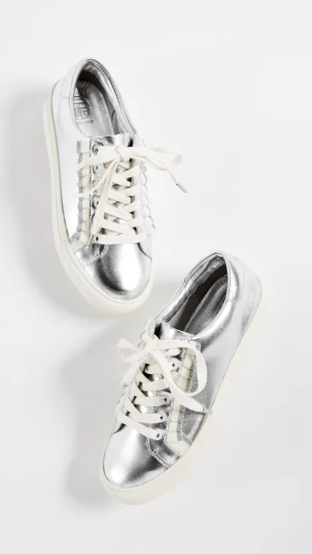 Tory Burch 
Tory Sport Ruffle Sneaker sold by Ruumur