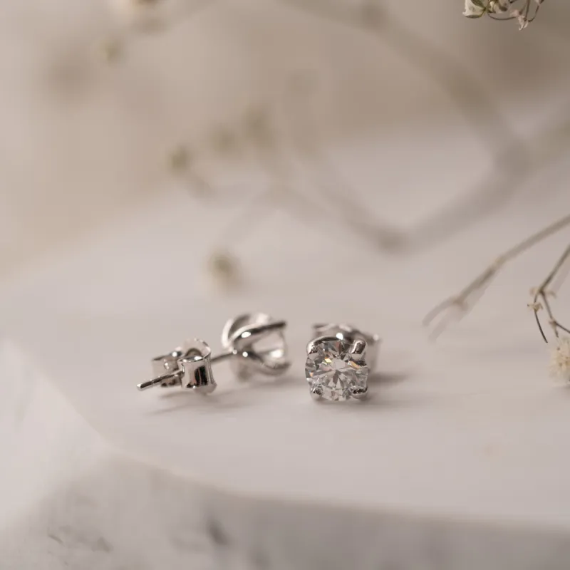 The Aria Earrings | 1.52ct D VVS2 Round Lab Diamond Twist Four Claw Solitaire 18k Gold sold by Ethica Diamonds