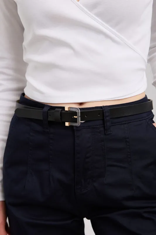 Belt with clear buckle sold by Tristan Style
