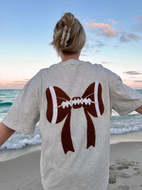 Football Bows Embroider Tee sold by Sunkissed Coconut