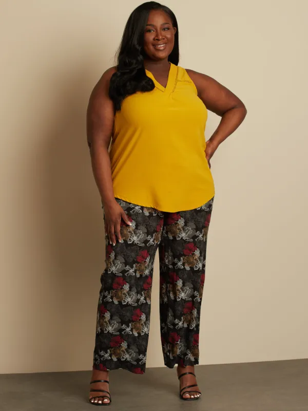 Sleeveless flared tunic sold by Claire France