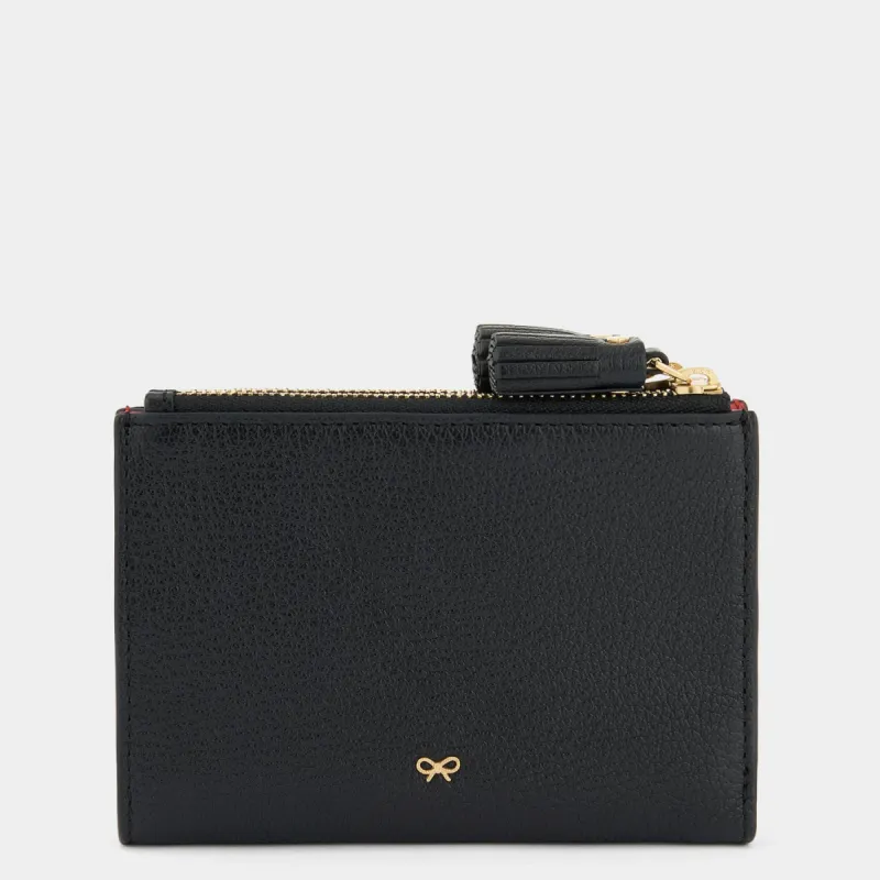 Peeping Eyes Small Double Zip Wallet sold by Anya Hindmarch
