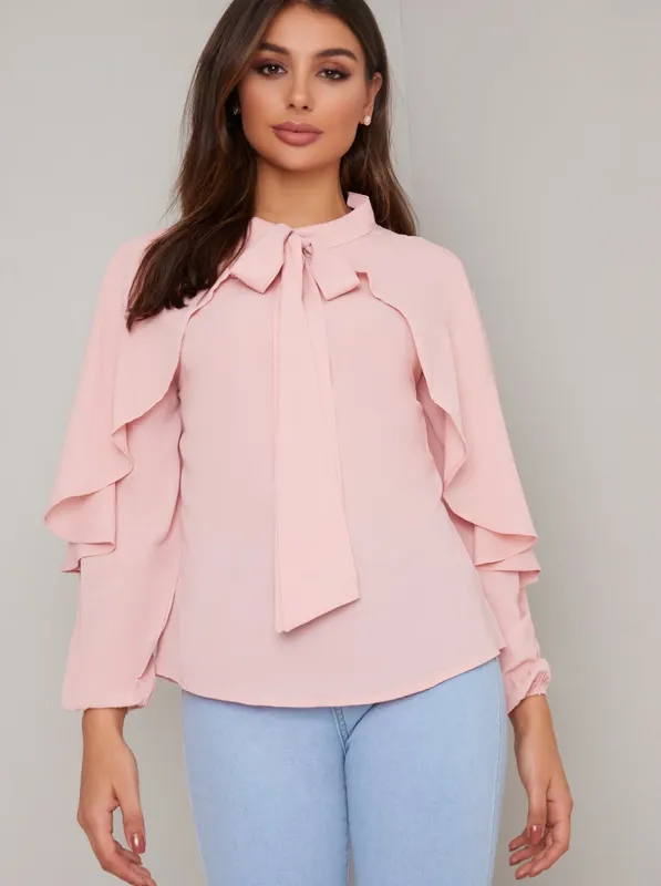 Ruffle Long Sleeved Top in Pink sold by Chi Chi London