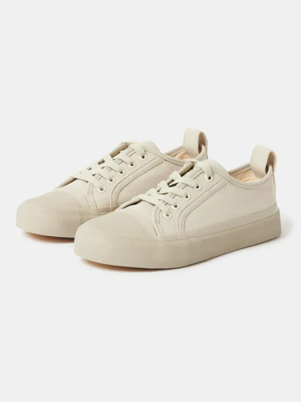 Byrd Canvas Shoe in Dove sold by Studio Nicholson