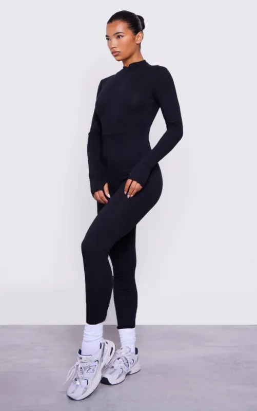 Black Cotton Zip Front Catsuit sold by Pretty Little Thing