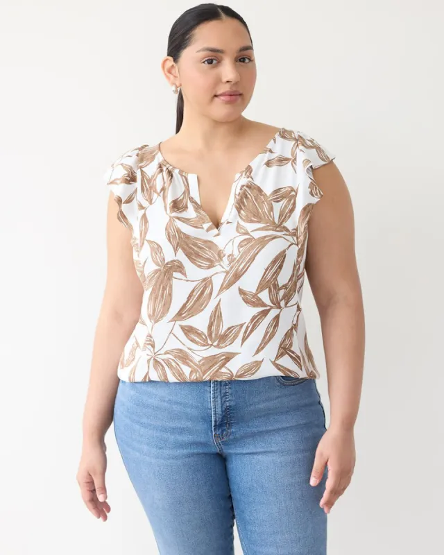 Sleeveless Split-Neck Blouse with Ruffled Shoulders sold by Reitmans