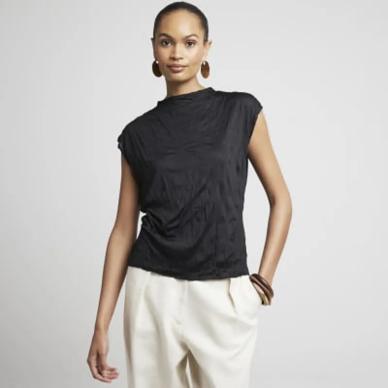 Black crinkle vest top sold by River Island