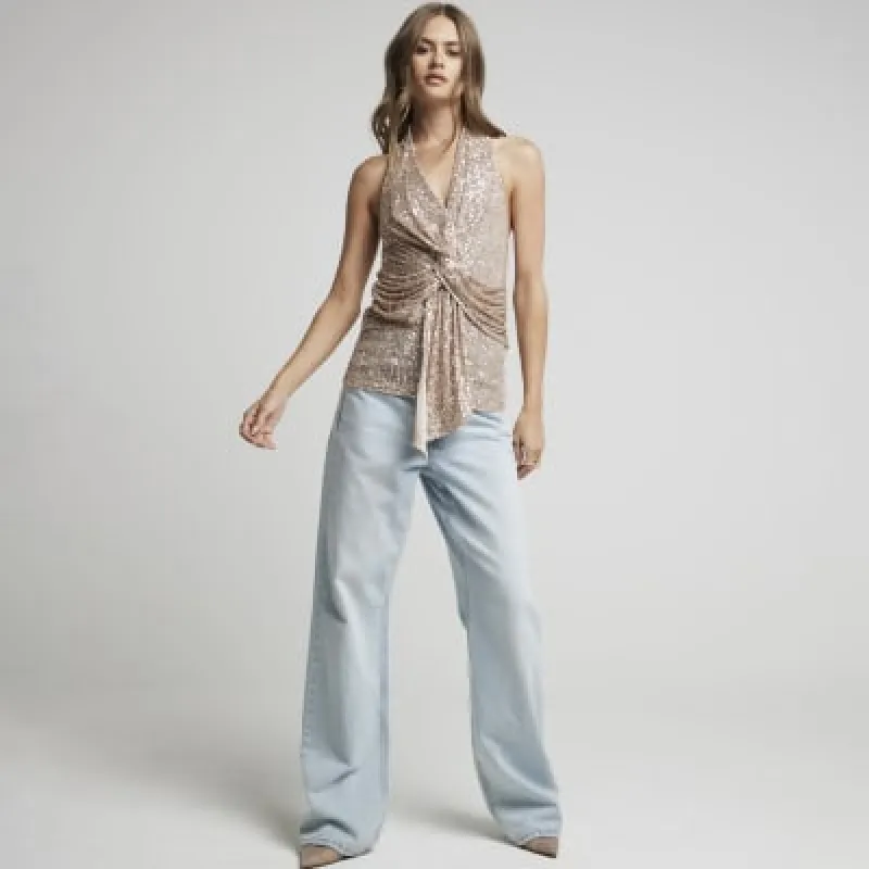 Rose gold sequin halter neck top sold by River Island