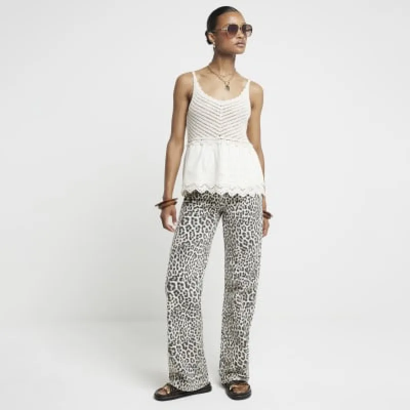 Cream crochet broderie trim vest top sold by River Island