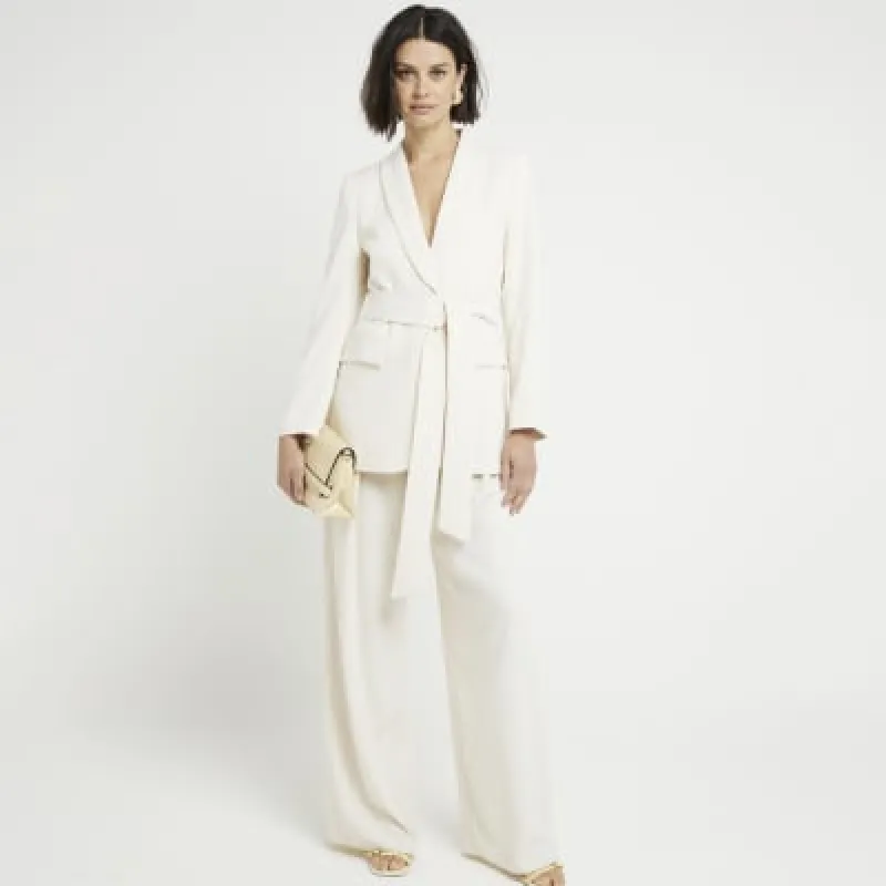 Cream belted wrap blazer sold by River Island