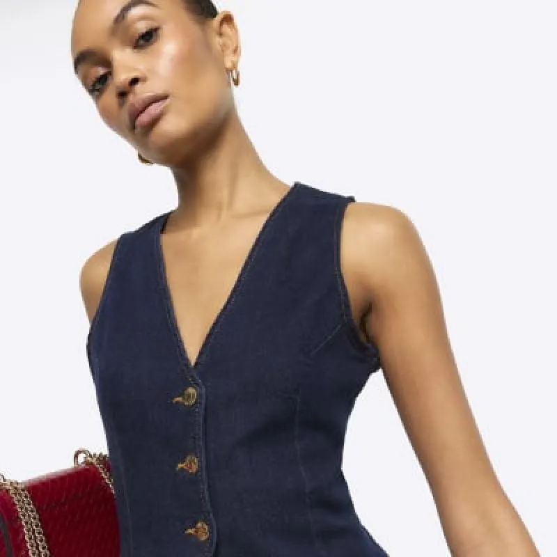 Blue button up denim waistcoat sold by River Island