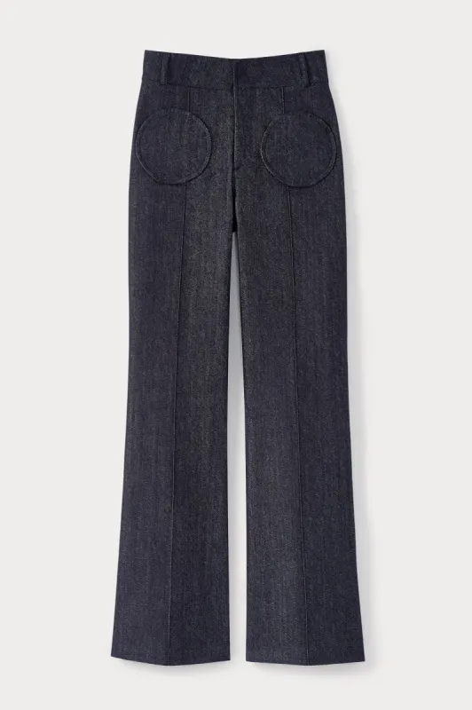 Navy blue denim flared pants with circular pocket details sold by DESTREE