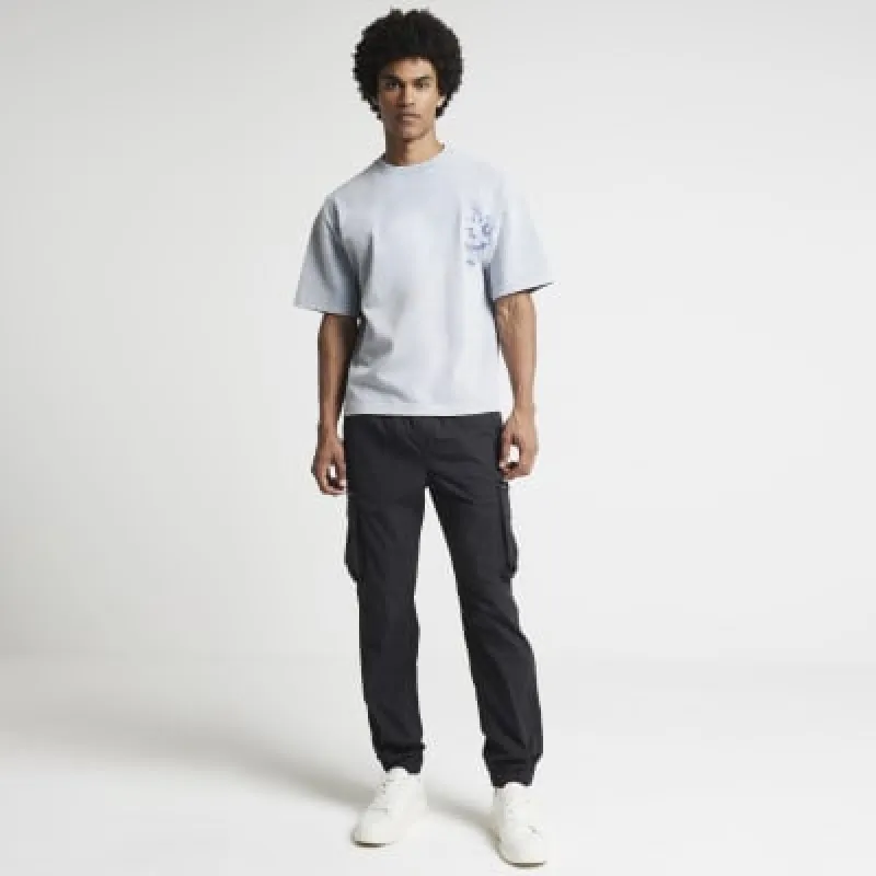 Black regular fit cargo trousers sold by River Island