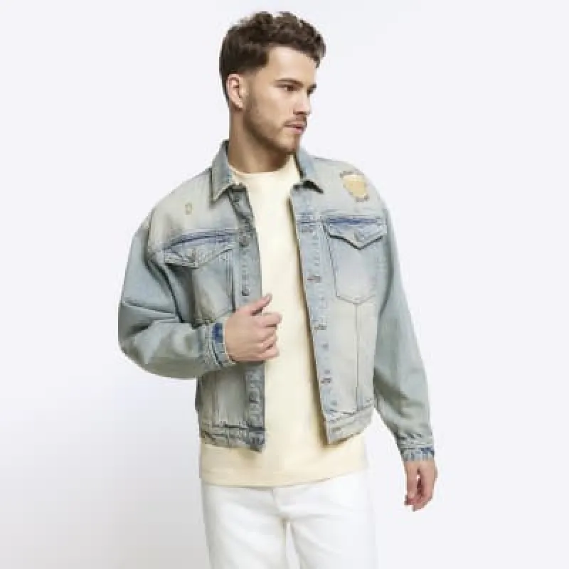 Blue oversized fit ripped denim jacket sold by River Island