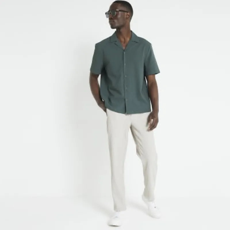 Beige slim fit plisse joggers sold by River Island